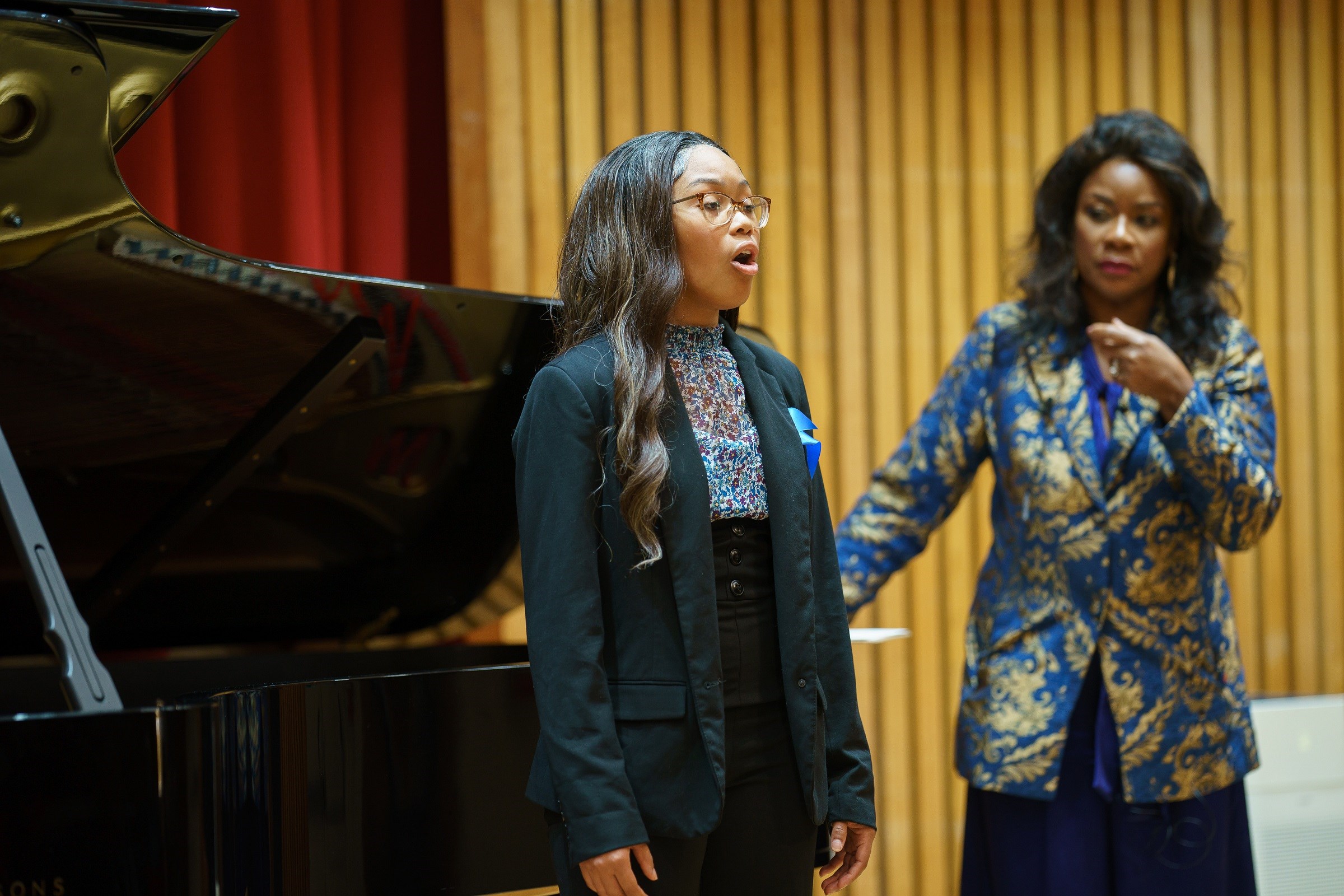 Denyce Graves (at right) coaches soprano Elise Golden at the launch of her foundation’s Shared Voices program. (photo: Matt Mendelsohn Photography)