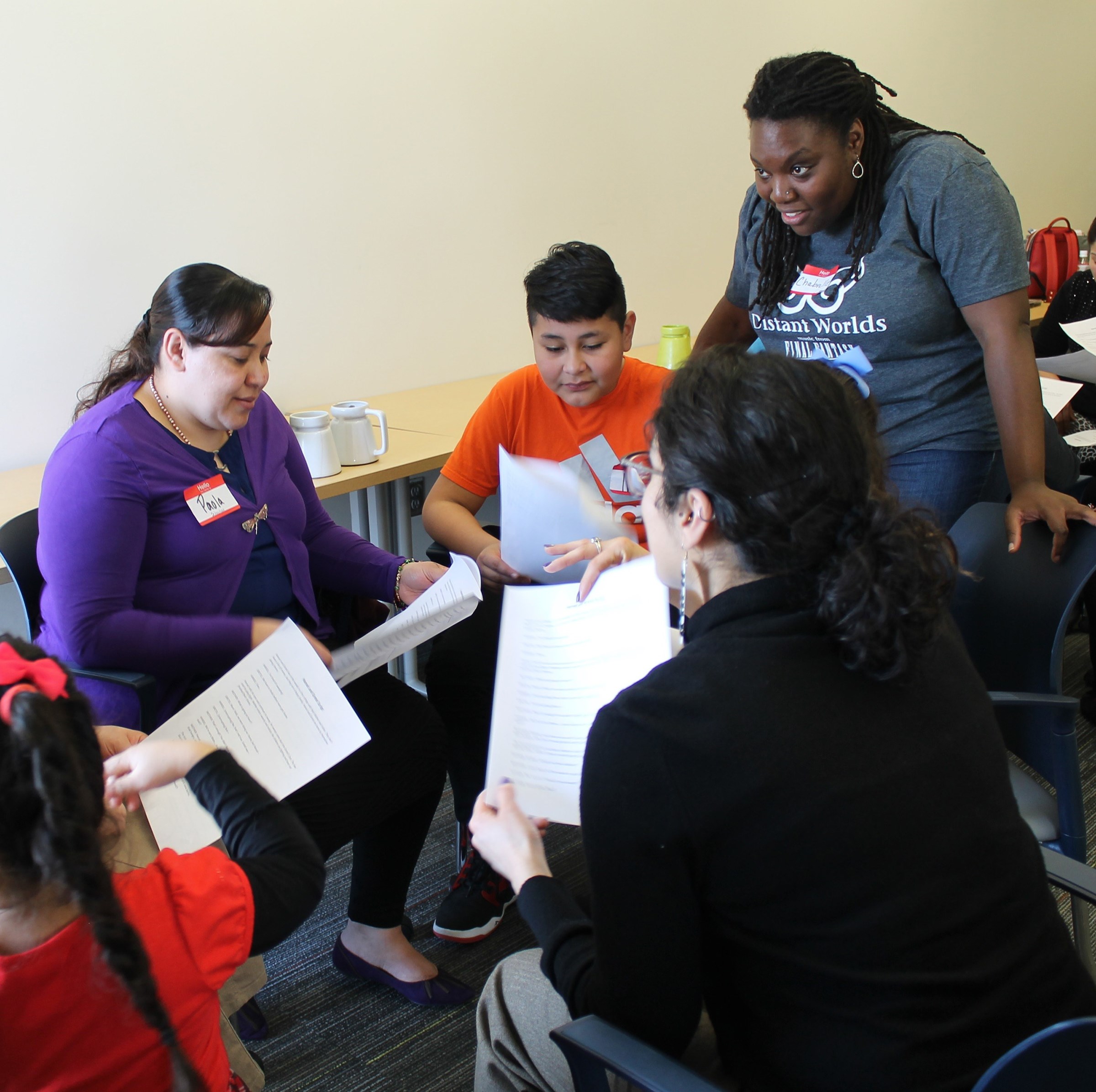 Chabrelle Williams (upper right), a Holland Fellow at Opera Omaha, with families at the Learning Community Center of South Omaha