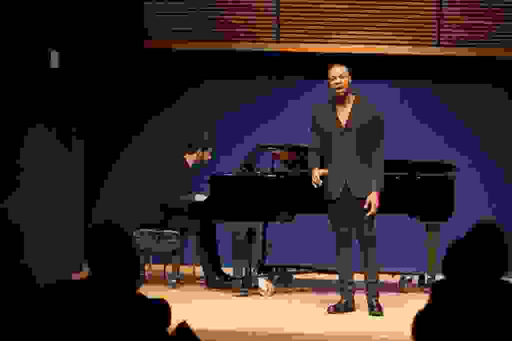 Davóne Tines performs at an Opera Center event featuring composer Matthew Aucoin (at piano)